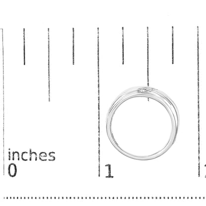 White ring with three round white gemstones in a channel setting, shown on a scale, top-down angle.