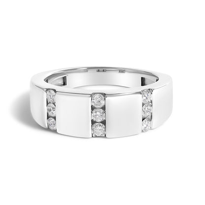 Close-up front angle of a white metal ring featuring three vertical channel-set rows of round white gemstones.