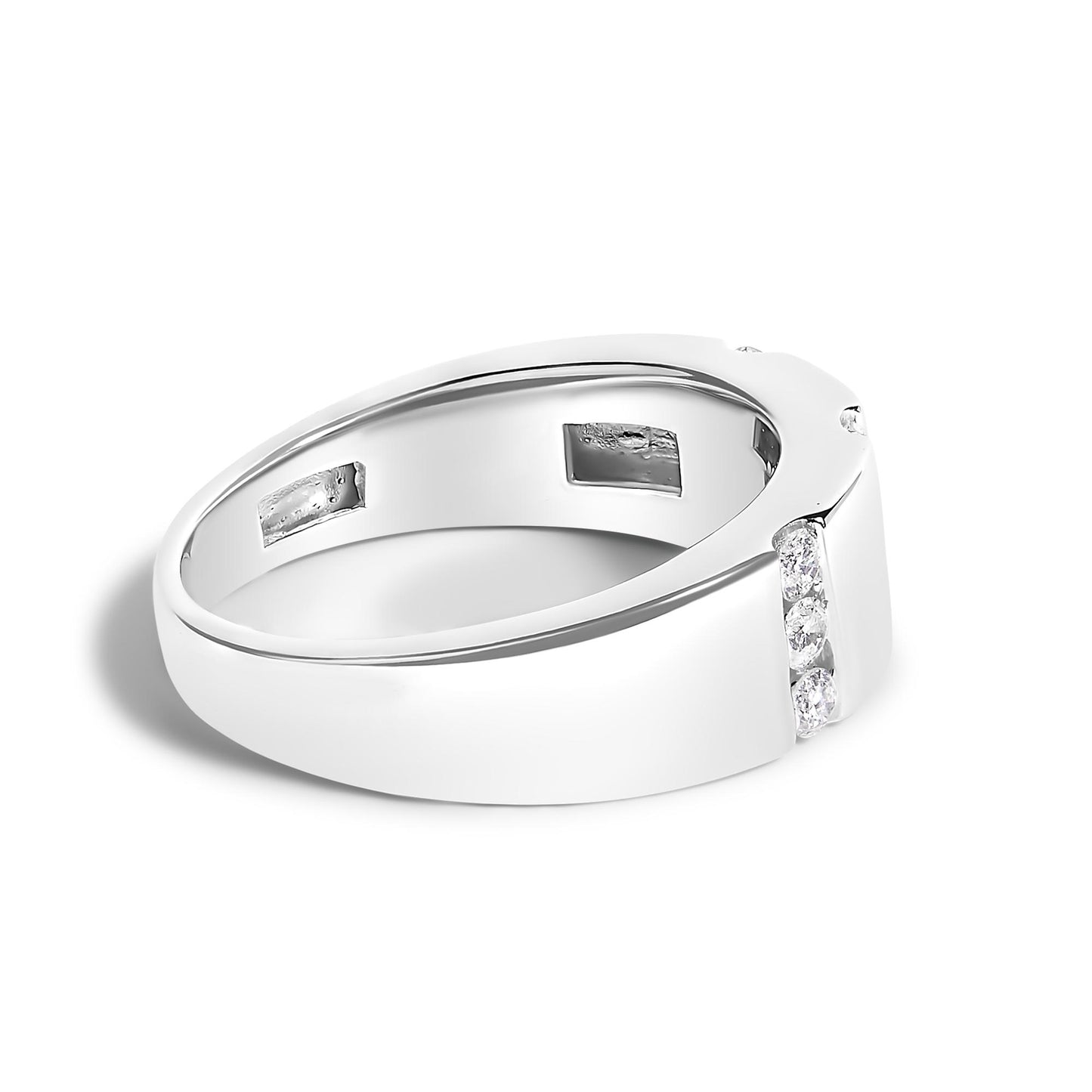 Close-up angled view of a white metal ring featuring a channel setting with round white gemstones along one side.