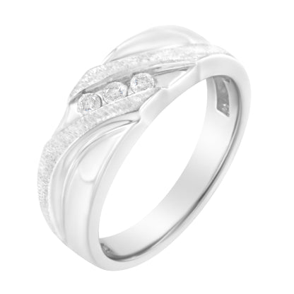 White metal ring with three round white gemstones set in a channel setting, shown at a slight angle.