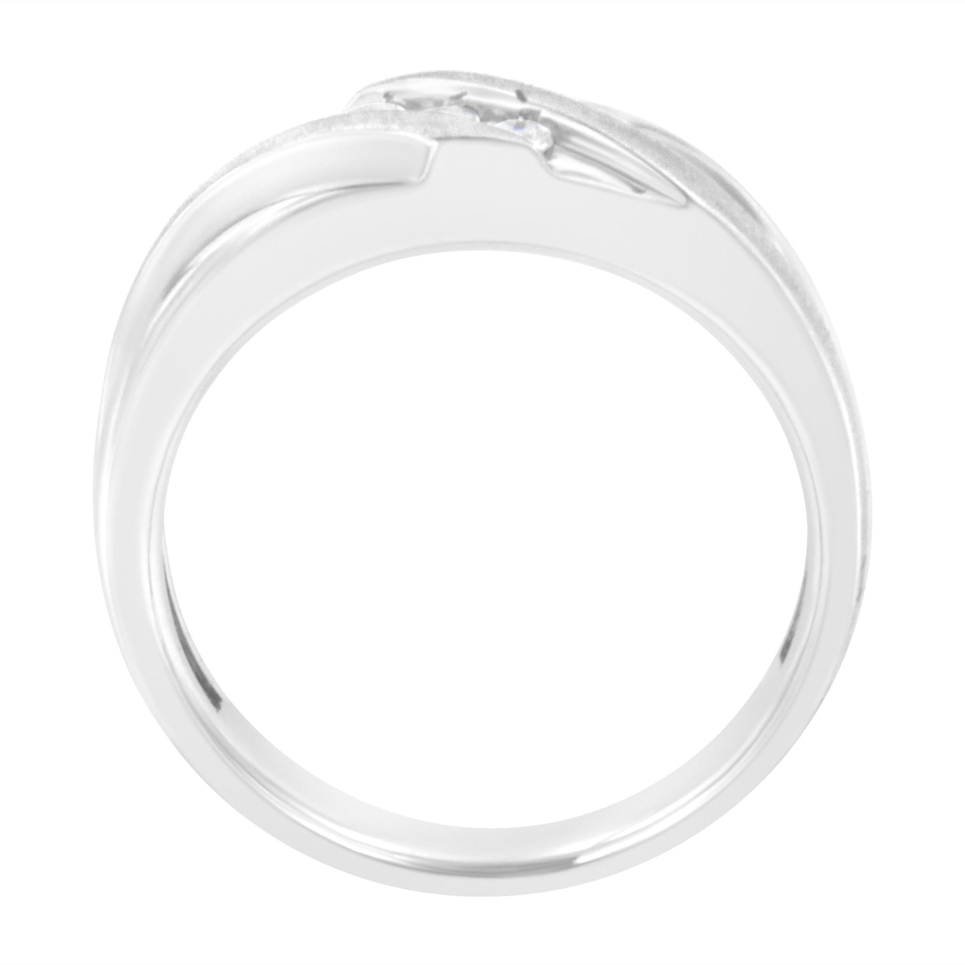 Close-up top-down view of a white ring with three round white gemstones in a channel setting.