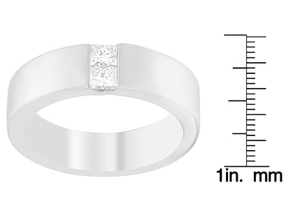 White metal ring with two princess-shaped white gemstones in channel setting, angled front view, shown next to a ruler for size reference.