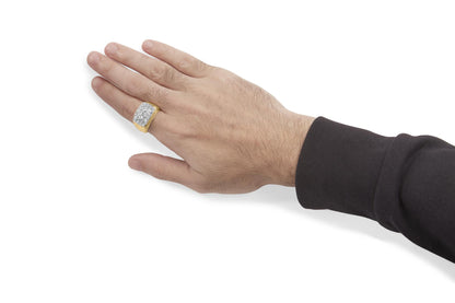 Side angle of a hand wearing a yellow and white ring with multiple white round gemstones in miracle settings on the ring finger.