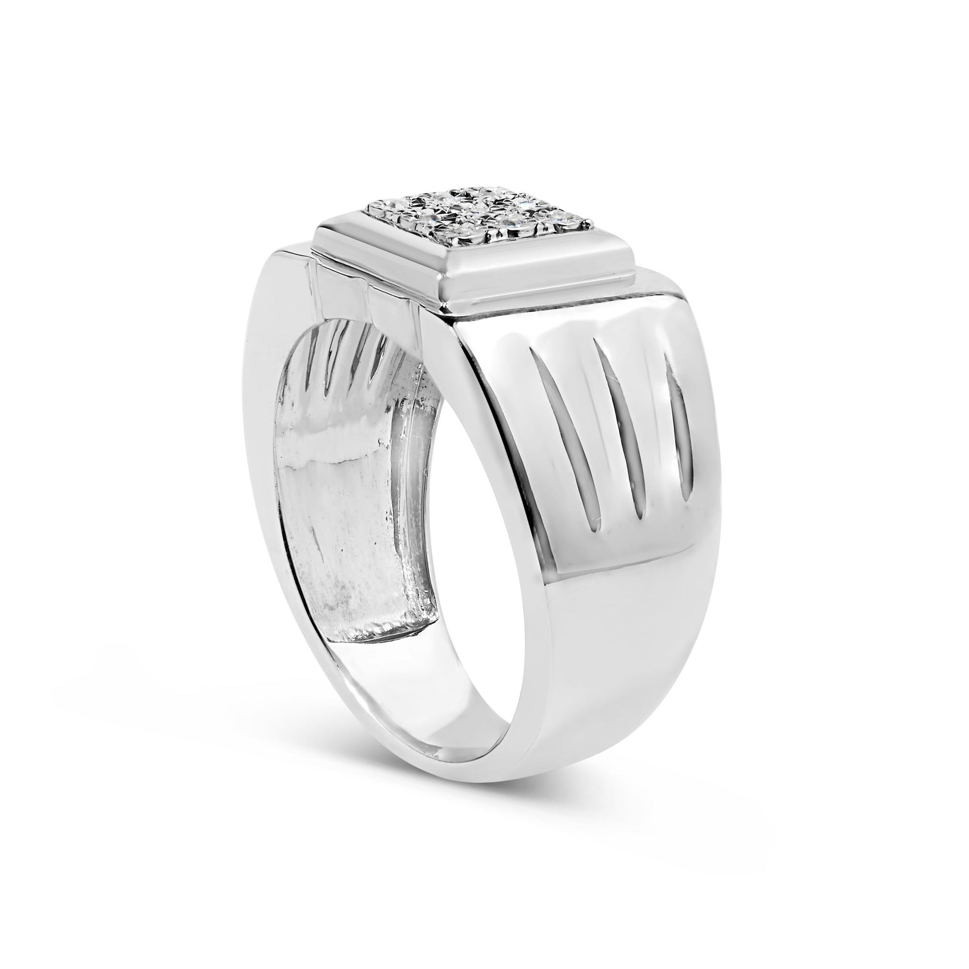White metal ring with a wide band and rectangular top featuring a cluster of round white gemstones set in a miracle setting, shown at a slight side angle on a white background.