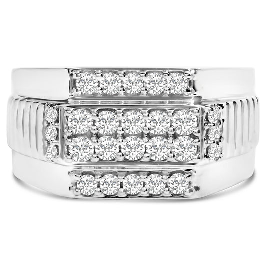 Front view of a white metal ring featuring multiple rows of round white gemstones in prong settings across the top.