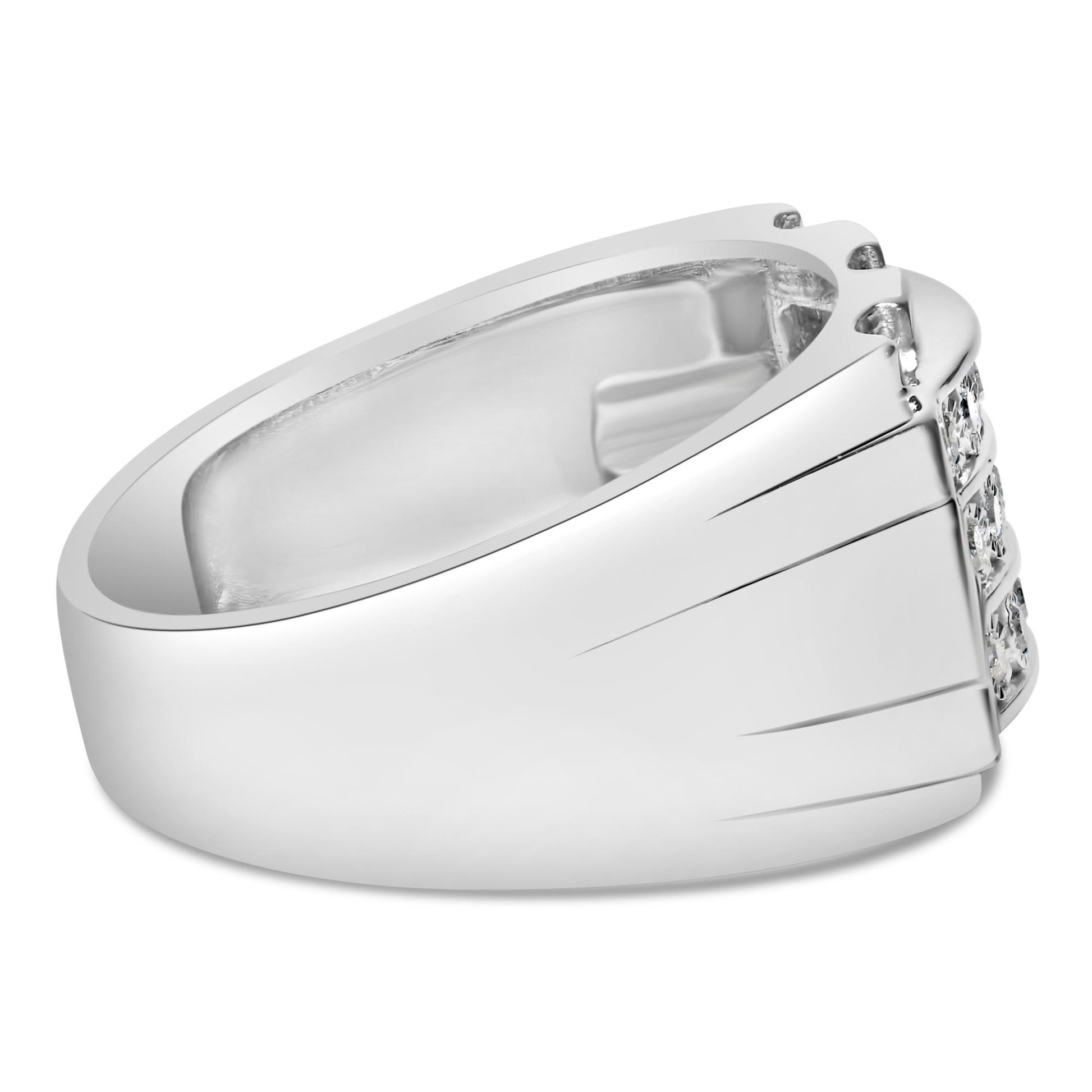 Close-up side angle of a white metal ring featuring a cluster of round white gemstones in miracle and channel settings on the front.