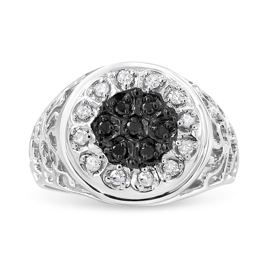 Front angle view of a white metal ring featuring round black gemstones in the center surrounded by round white gemstones, all in prong settings, with detailed band sides.