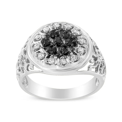White metal ring with a round cluster of black and white round gemstones in prong settings, viewed from the front angle.