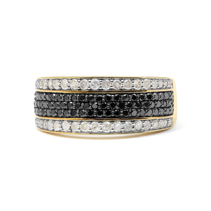 Close-up front view of a yellow metal ring featuring three horizontal rows of prong-set round white and black gemstones.