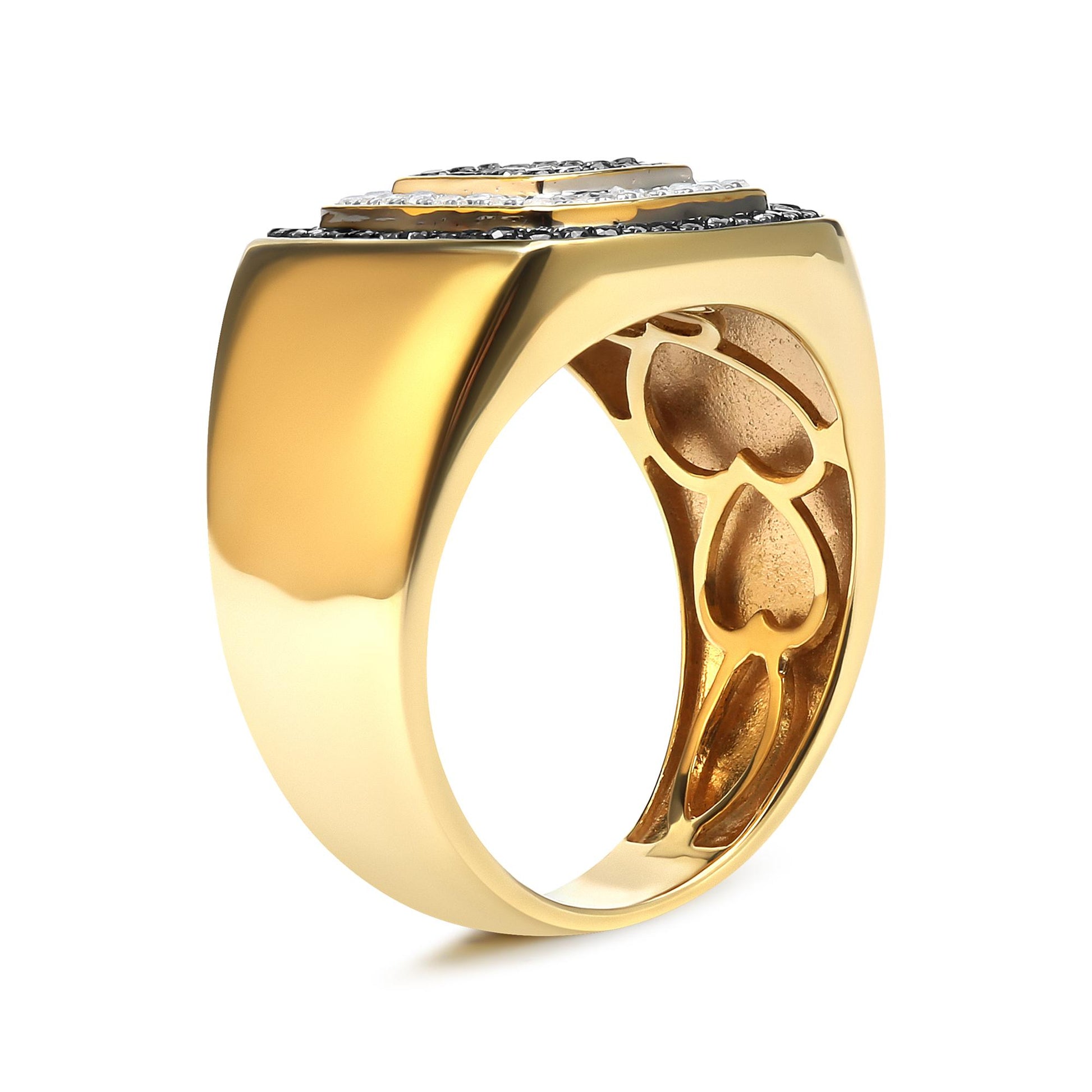 Yellow metal ring with black and white round gemstones in prong settings, shown at a side angle.