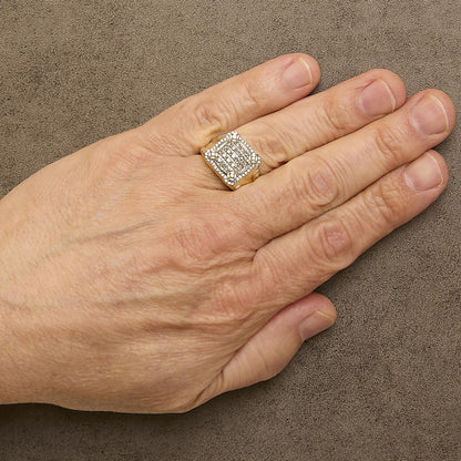 Close-up angled view of a yellow ring with multiple rows of small white gemstones in prong settings, shown worn on a model's finger.