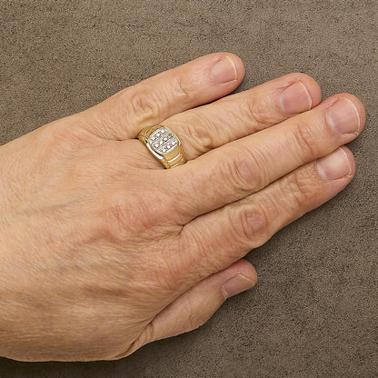 Close-up front angle of a yellow ring with rows of prong-set round white gemstones, shown worn on a model's finger.