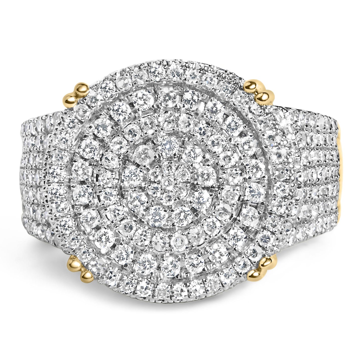 Close-up front angle of a yellow metal ring featuring an oval-shaped top covered with multiple small white gemstones in a layered circular design.