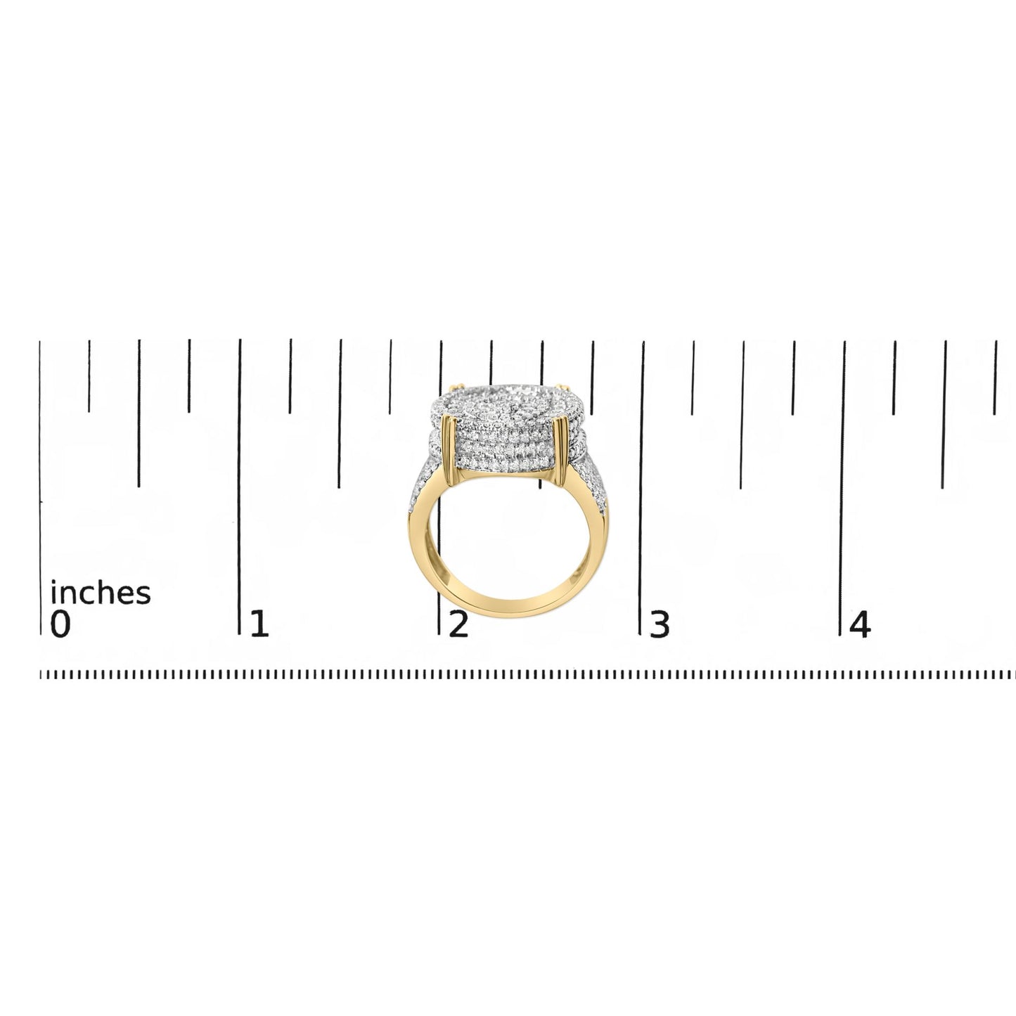 Yellow metal ring with multiple rows of white gemstones in a square cluster, shown on a ruler scale, side angle view.