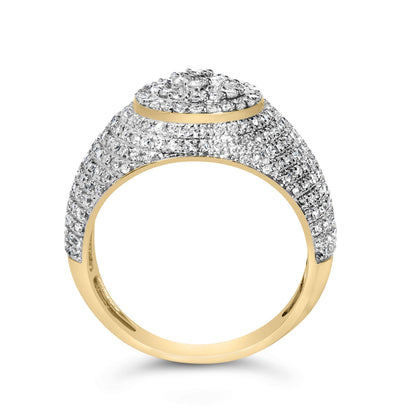 Close-up front angle of a yellow metal ring encrusted with numerous small white round gemstones in prong settings on the top and upper sides.