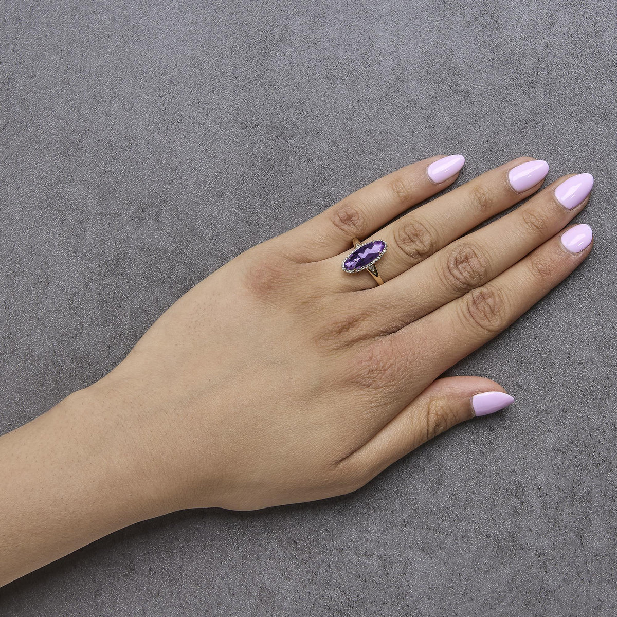 10K Yellow Gold Purple Oval Amethyst and 1/6 Cttw Diamond Halo Cocktail Ring