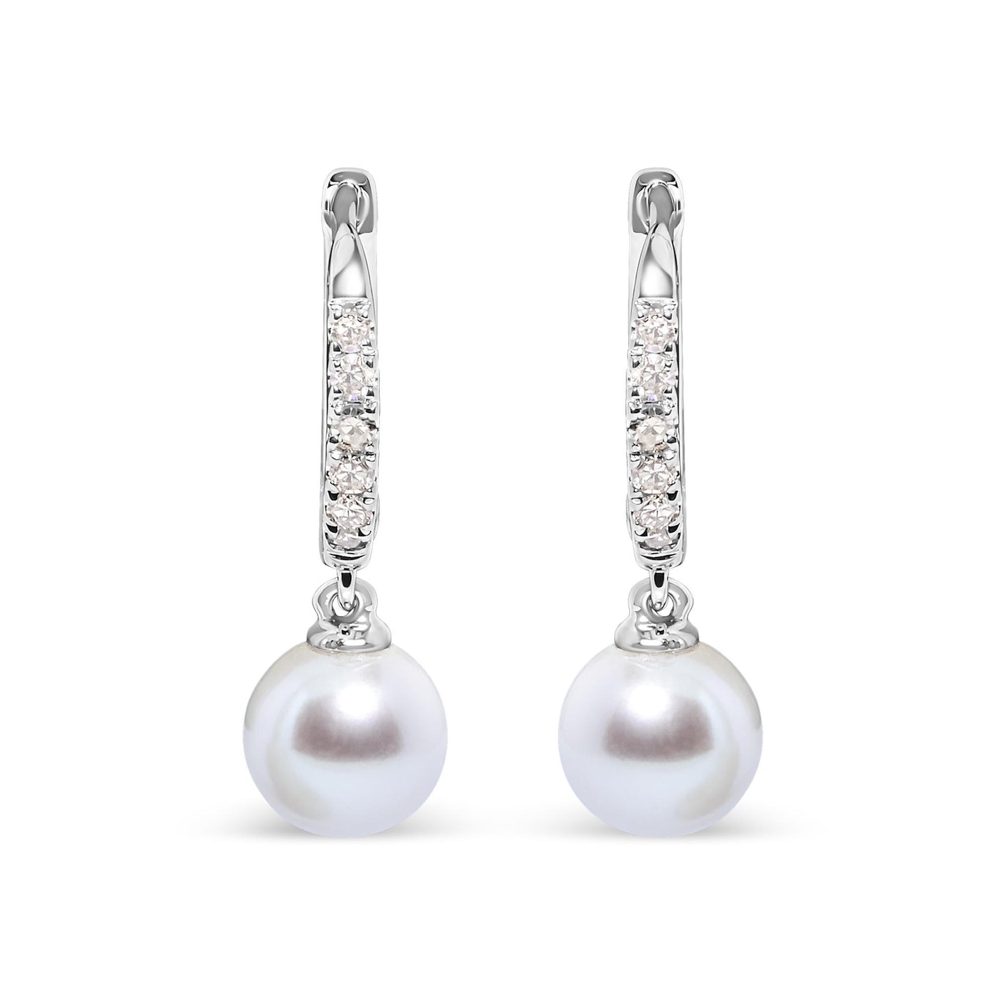 Front-facing view of white metal earrings with a hoop section featuring rows of small white gemstones in pave settings, each earring holding a single round white pearl drop.