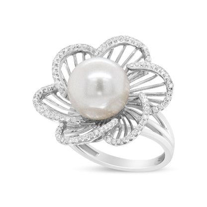 White metal floral ring with a large central white gemstone and petals outlined with small white gemstones, shown at an angle.