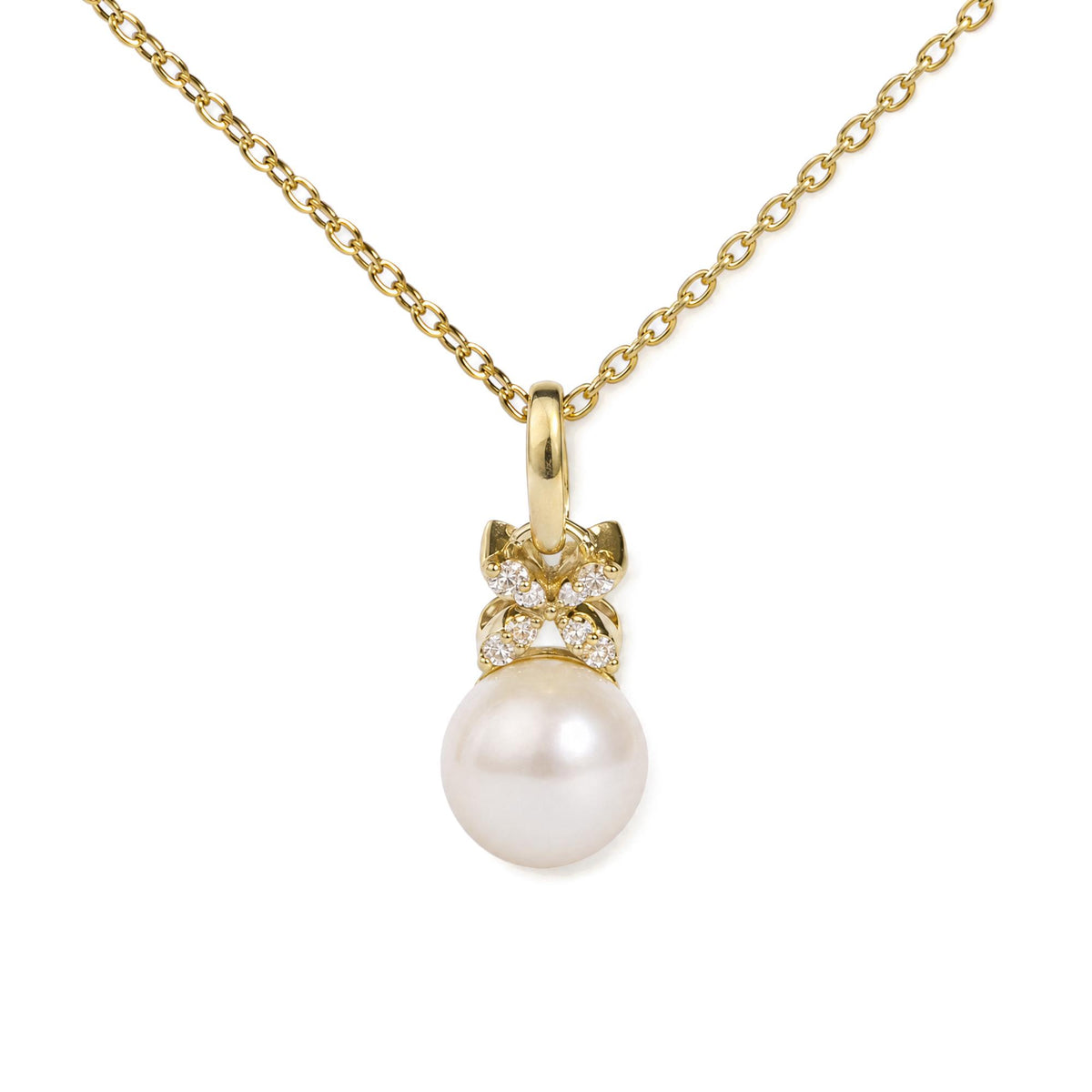 Close-up front view of a yellow metal necklace with a pendant featuring white gemstones and a large round pearl, shown on a white background.