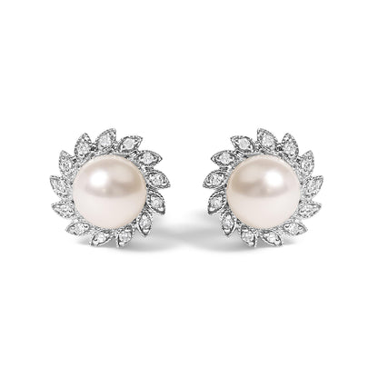 Pair of white metal stud earrings with round white centerpiece gemstones, surrounded by a halo of small white gemstones in a pave setting, shown from the front on a white background.