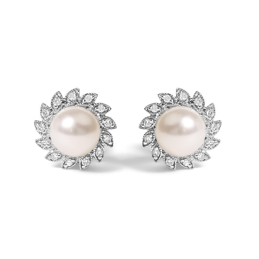 Pair of white metal stud earrings with round white centerpiece gemstones, surrounded by a halo of small white gemstones in a pave setting, shown from the front on a white background.
