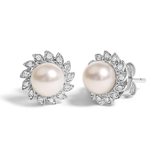 Pair of white metal stud earrings with round central pearls surrounded by a halo of marquise-shaped settings with small white gemstones, shown in a front angled view on a white background.