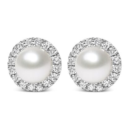 Front view of a pair of white metal stud earrings featuring a large central white gemstone surrounded by a circle of small white gemstones in a pave setting.