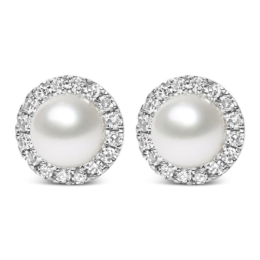 Front view of a pair of white metal stud earrings featuring a large central white gemstone surrounded by a circle of small white gemstones in a pave setting.