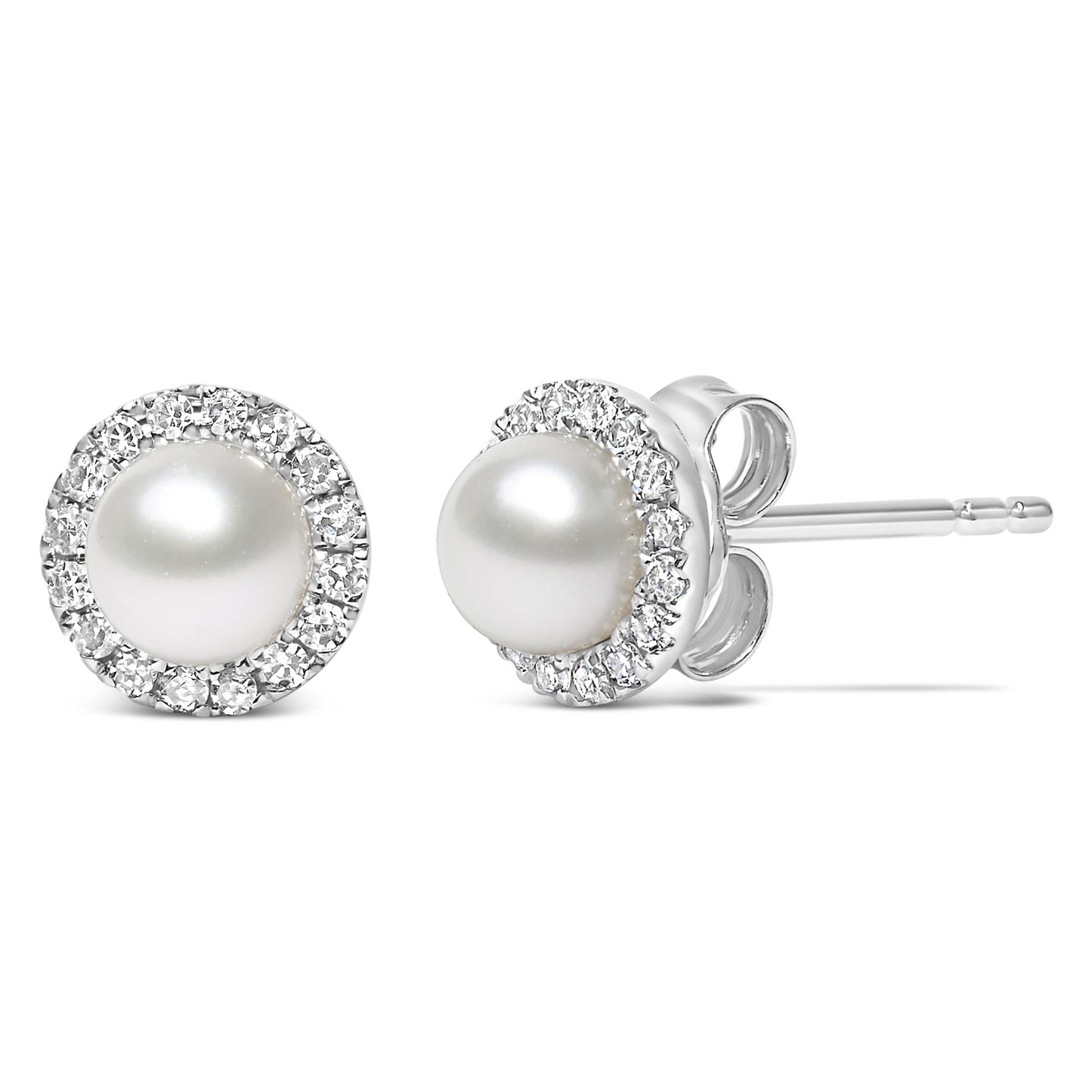 Close-up front and side view of a pair of white stud earrings with a central round white gemstone surrounded by a pave setting of small round white gemstones.