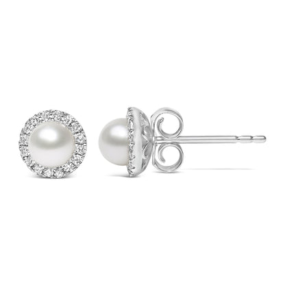 Close-up front and side view of white stud earrings featuring a central round white gemstone encircled by pave-set round white gemstones.