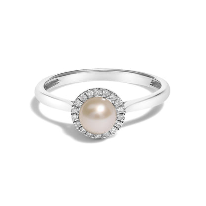 Close-up front angle of a white metal ring featuring a round central pearl surrounded by a halo of small white gemstones in a micro-pave setting.