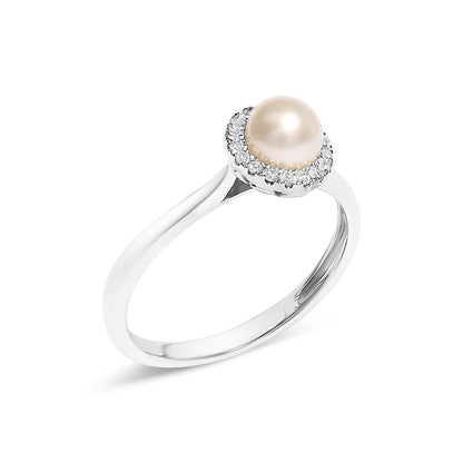 White metal ring with a central round pearl surrounded by a micro-pave setting of small white gemstones, shown at a slight angle.