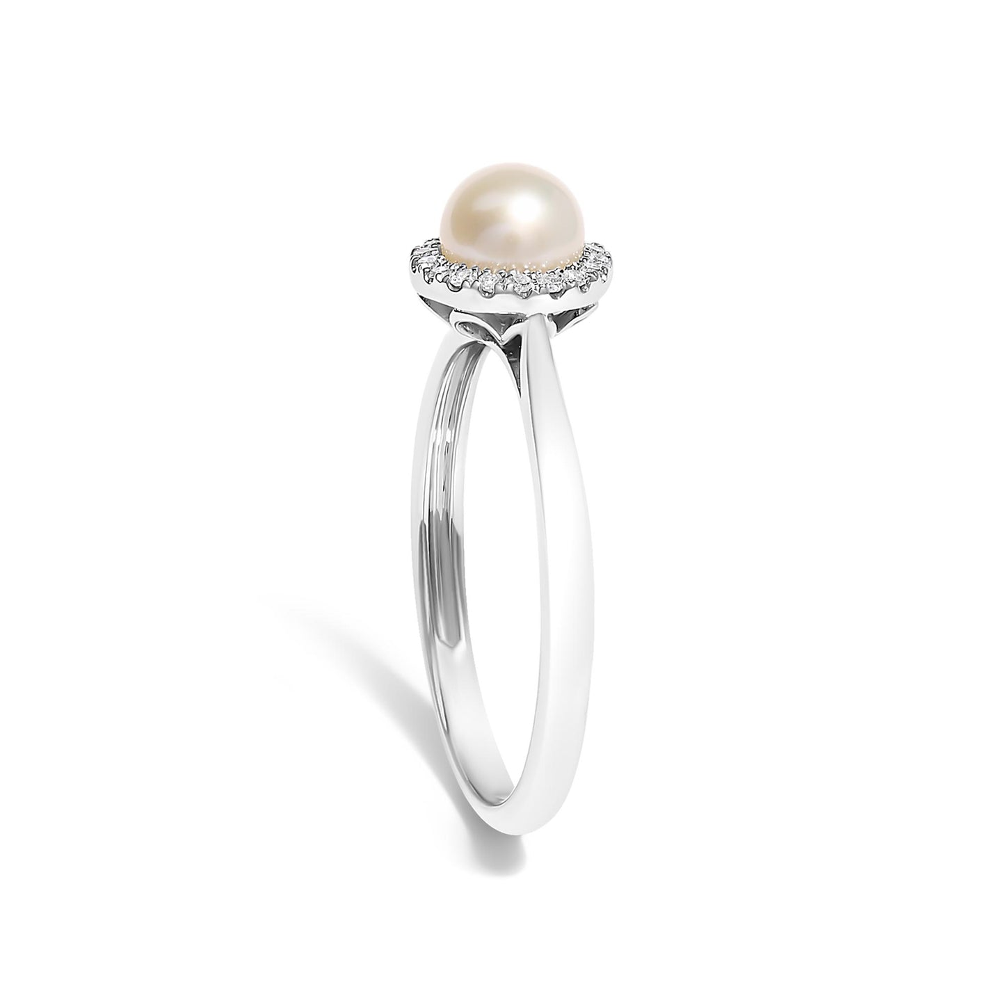 White metal ring shown at a slight angle with a central round pearl surrounded by a halo of small white gemstones in a micro-pave setting.