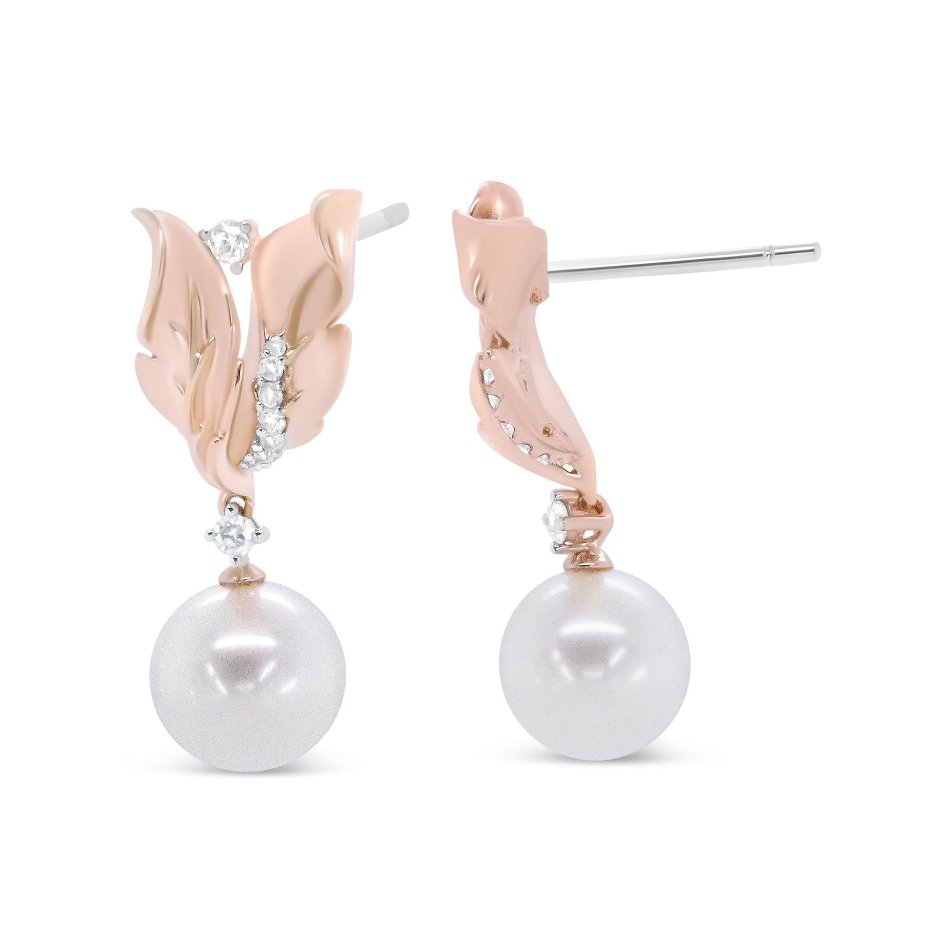 Front and side view of rose metal earrings with leaf design accented by prong-set white round gemstones and a single large white pearl drop.