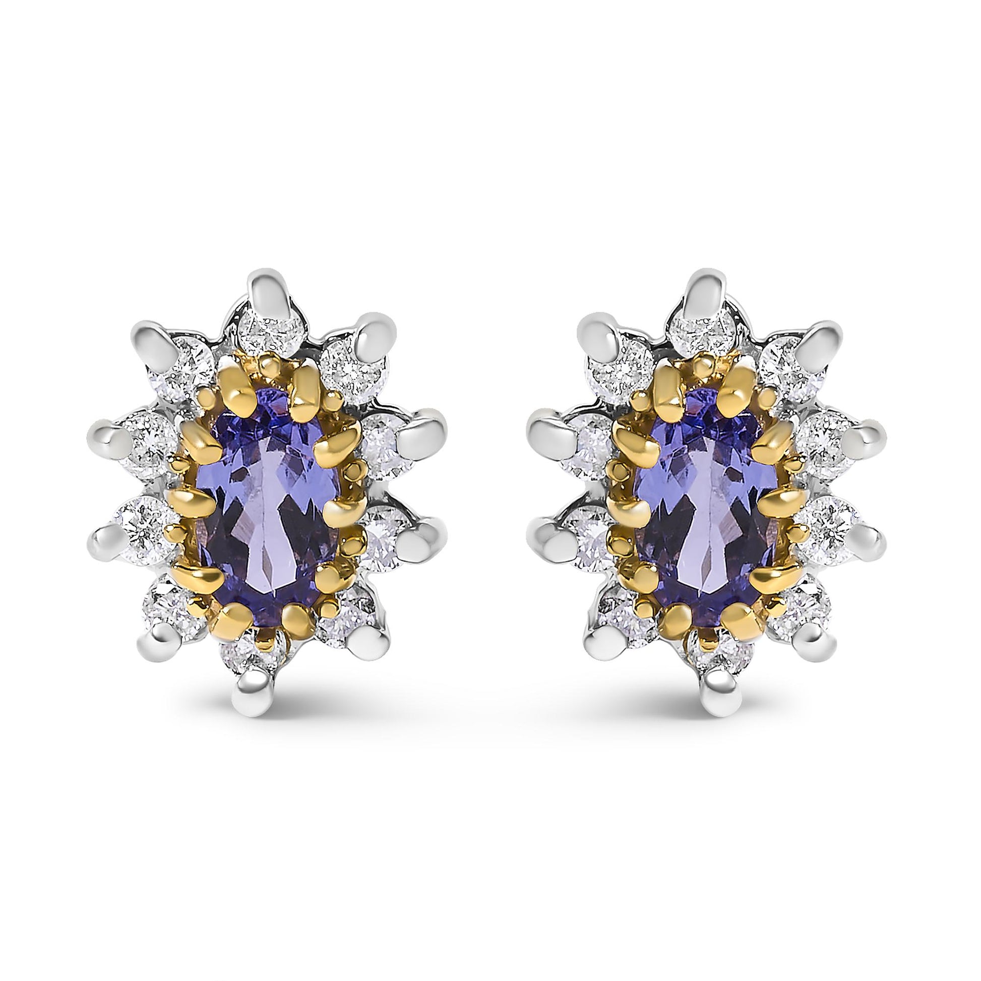 Front view of a pair of yellow metal stud earrings each featuring an oval blue gemstone surrounded by multiple round white gemstones in prong settings.