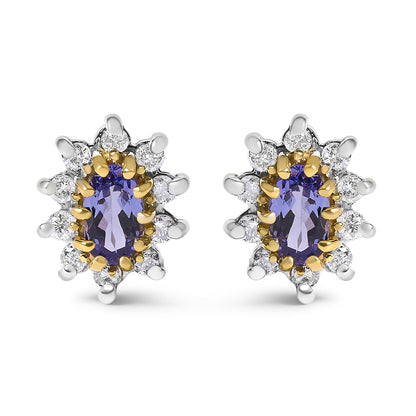 Front view of a pair of yellow metal stud earrings each featuring an oval blue gemstone surrounded by multiple round white gemstones in prong settings.