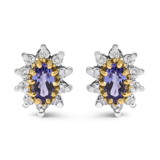 Front view of a pair of yellow metal stud earrings each featuring an oval blue gemstone surrounded by multiple round white gemstones in prong settings.