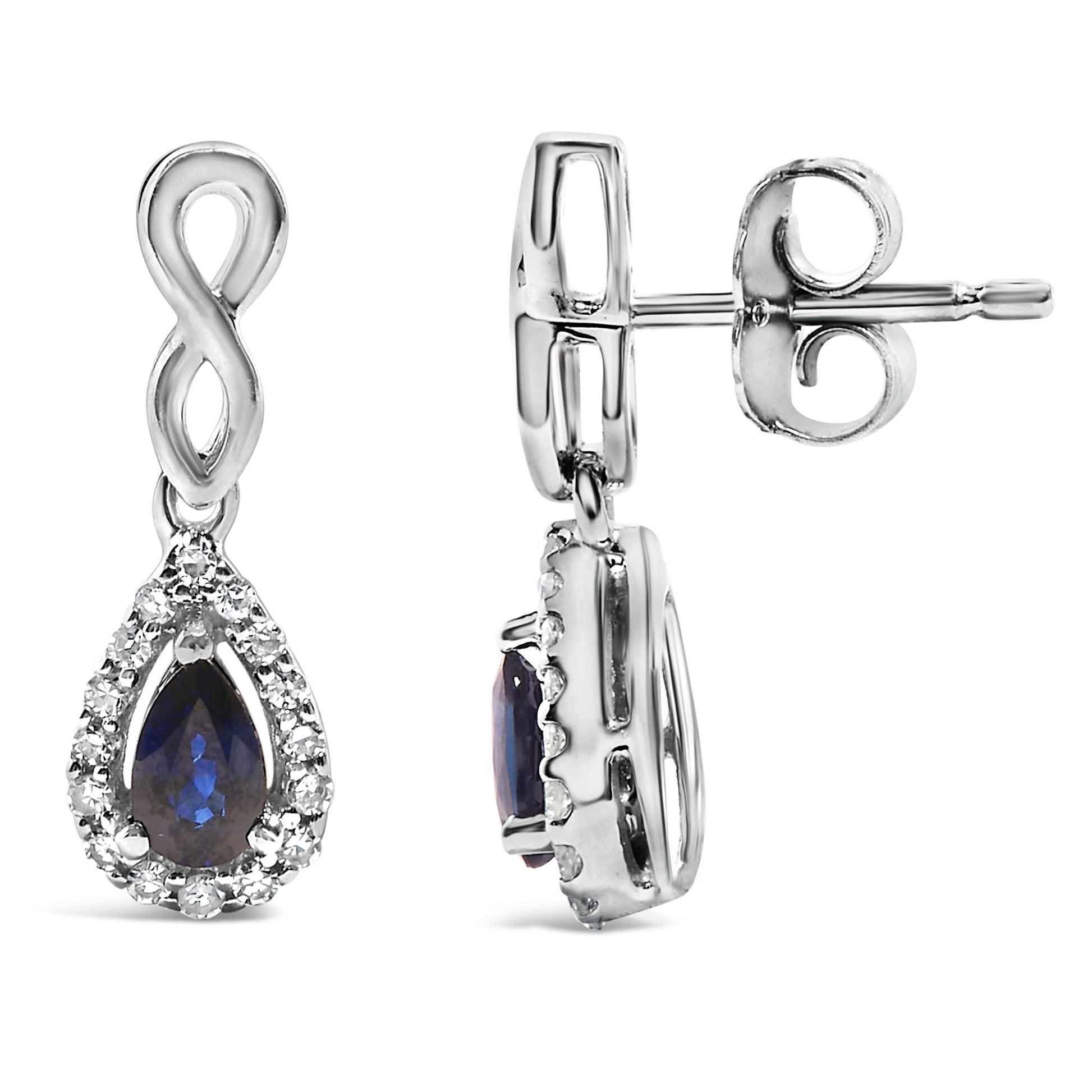 White metal earrings shown in a front and side view, featuring an infinity shape at the top, with a pear-shaped blue gemstone surrounded by a halo of small white gemstones hanging below.