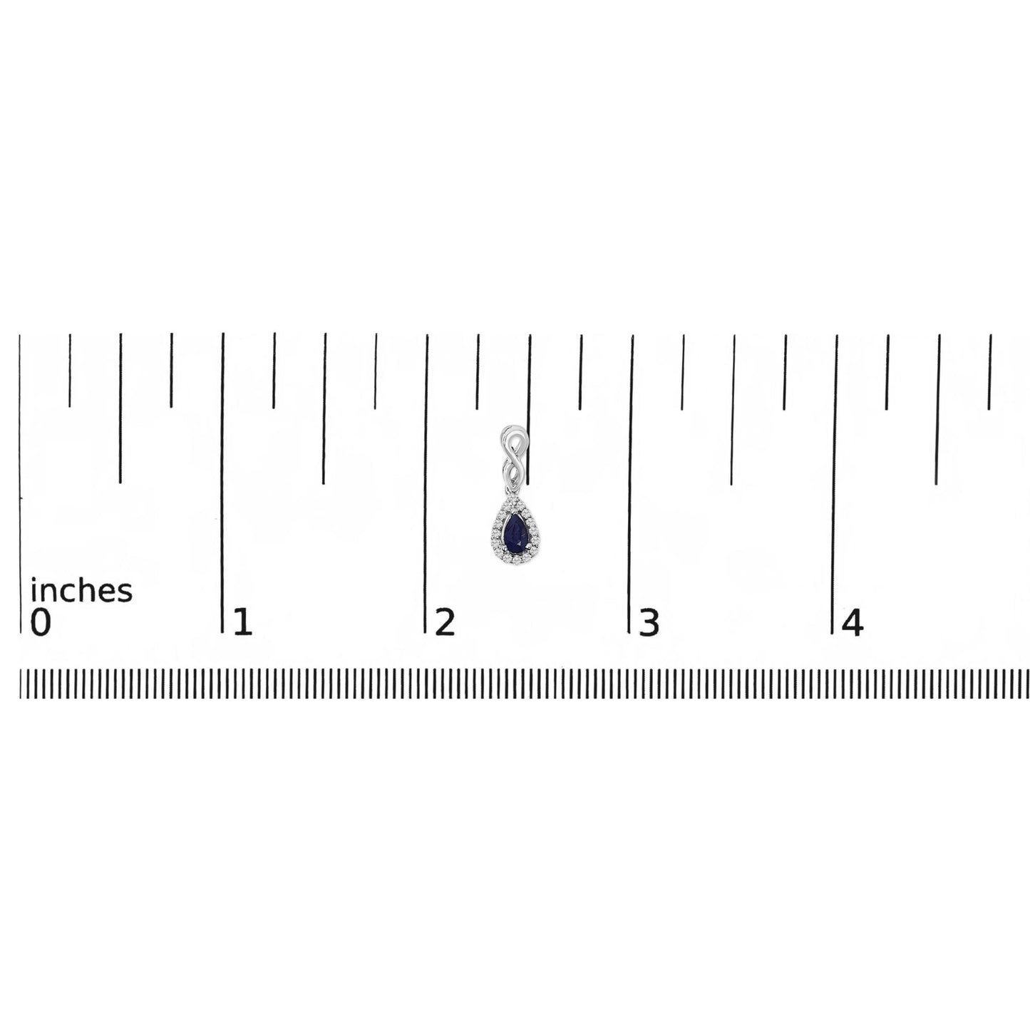 White metal earring with an infinity loop design and pear-shaped blue gemstone surrounded by small white gemstones, shown on a ruler scale from a front angle.