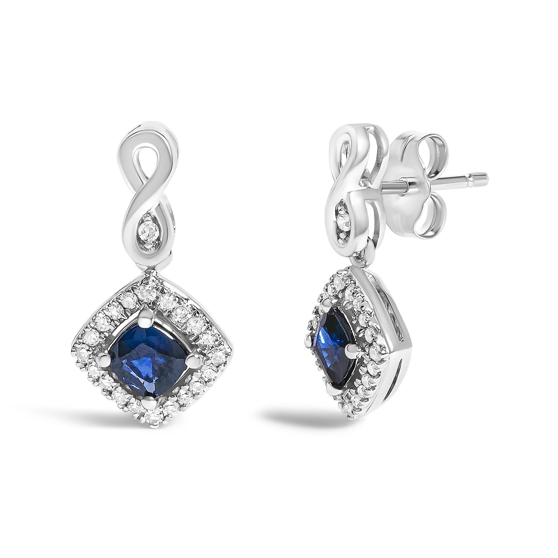 Front and side view of white metal earrings with an infinity-shaped top and a square-shaped drop featuring a blue gemstone center surrounded by small white gemstones.
