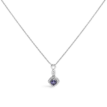 White metal necklace with a pendant featuring an infinity shape above a cushion-shaped blue gemstone surrounded by small round white gemstones, shown from the front.