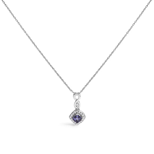 White metal necklace with a pendant featuring an infinity shape above a cushion-shaped blue gemstone surrounded by small round white gemstones, shown from the front.