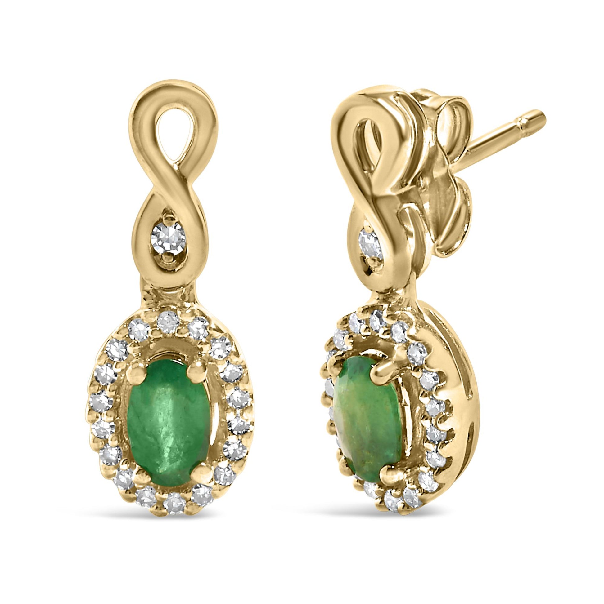 Close-up front and side view of yellow metal earrings with an infinity-shaped loop, featuring a prong-set oval green gemstone surrounded by a halo of small round white gemstones in a pave setting.