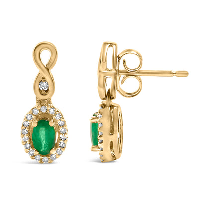Front and side view of yellow metal drop earrings with an oval green gemstone surrounded by small white gemstones, and an infinity loop design featuring a single white gemstone, shown on a white background.