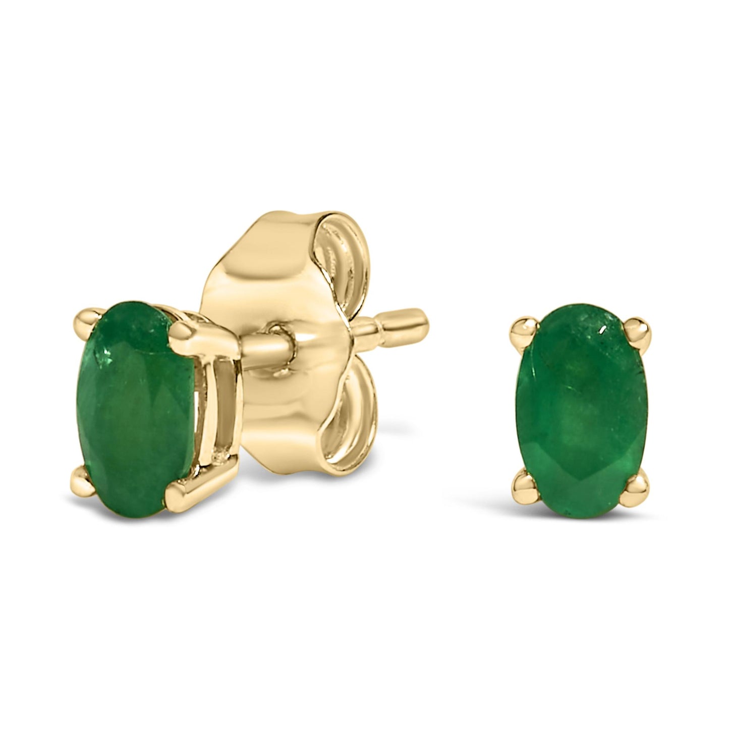 Close-up image of yellow metal stud earrings featuring oval green gemstones set in prongs, shown from a slight side angle.