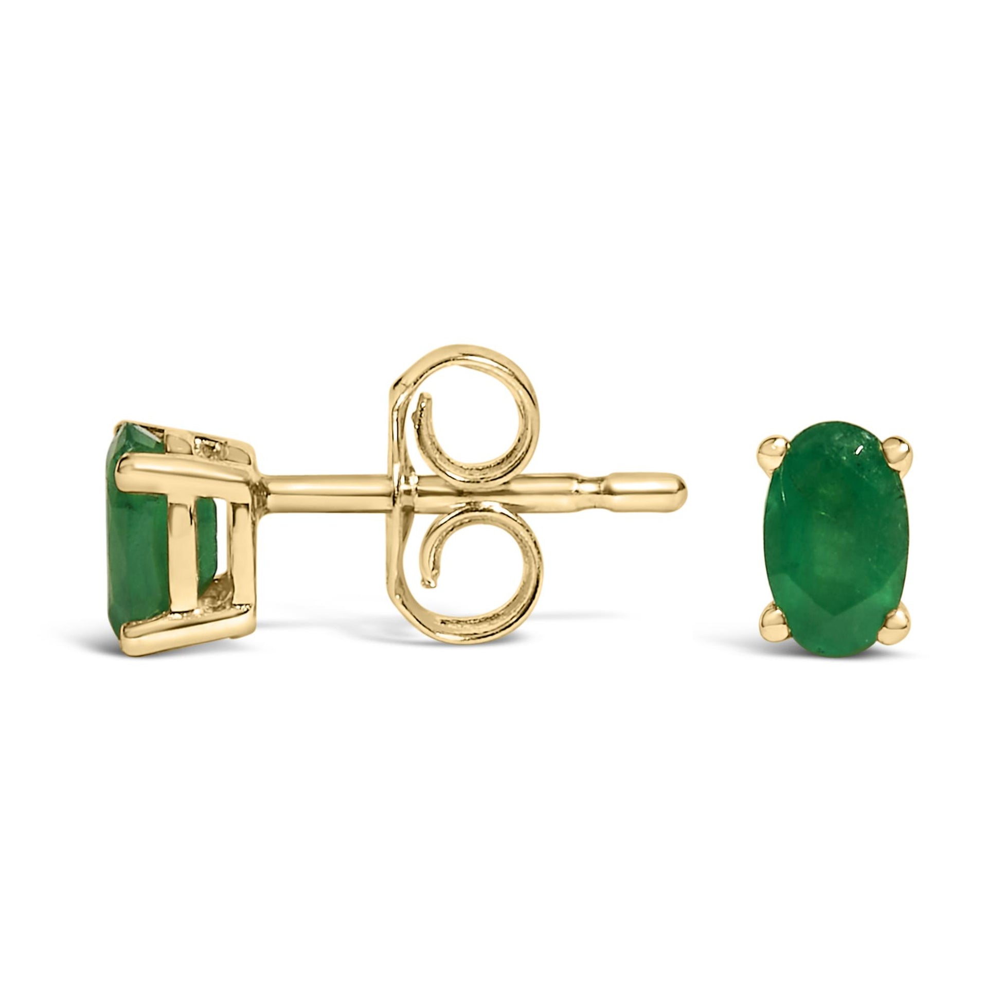 Pair of yellow metal stud earrings with oval green gemstones in prong settings, shown from side and front angles.