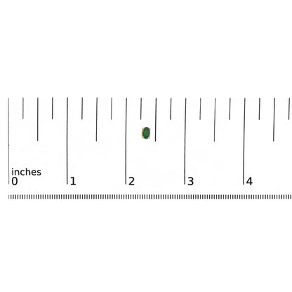 Close-up front angle of a single yellow metal earring with an oval green gemstone in a prong setting, placed on a ruler for size reference.