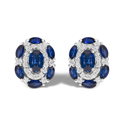 Pair of oval-shaped white metal earrings shown from the front on a white background, featuring blue oval and marquise gemstones surrounded by small round white gemstones in prong settings.