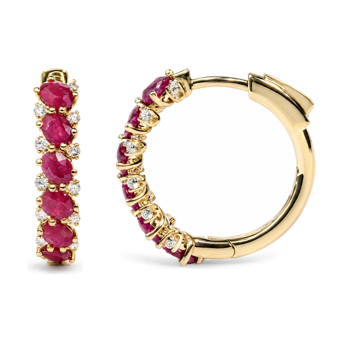 Close-up angled view of yellow metal hoop earrings featuring oval red gemstones and round white gemstones in prong settings.