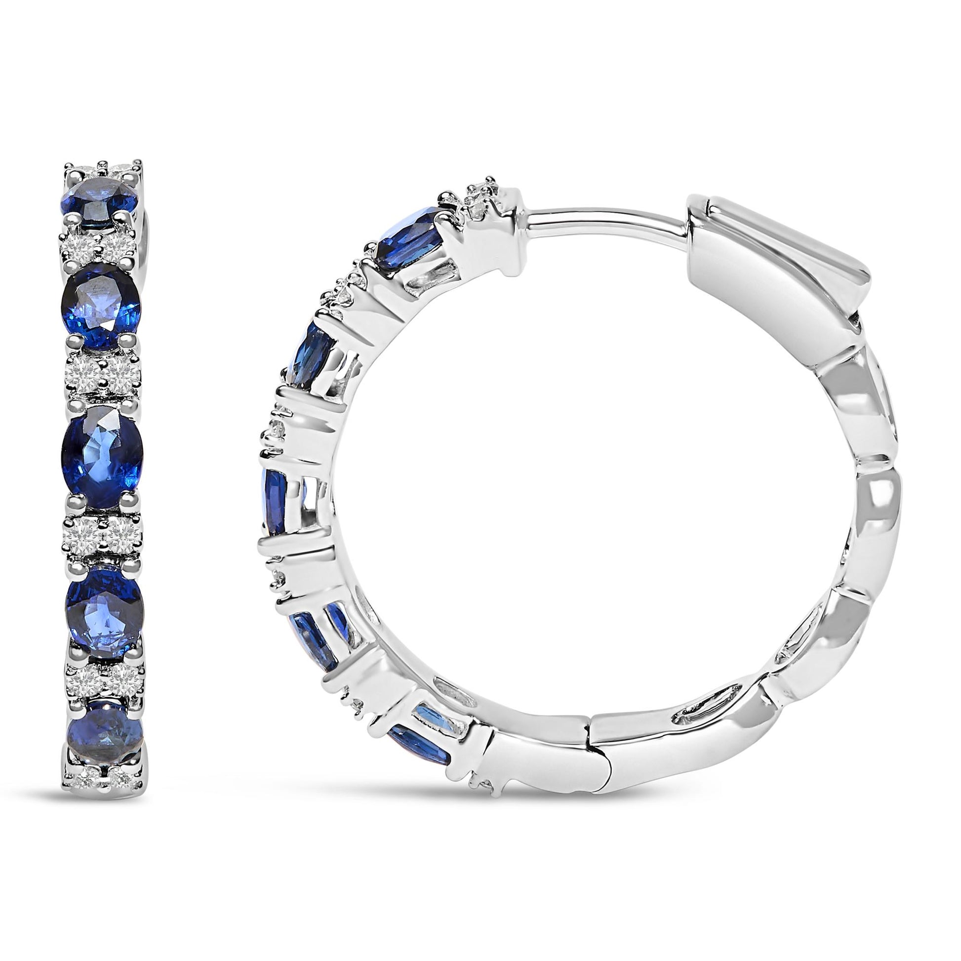 Pair of white metal hoop earrings with alternating round white gemstones and oval blue gemstones in prong settings, shown from front and side angles on a white background.